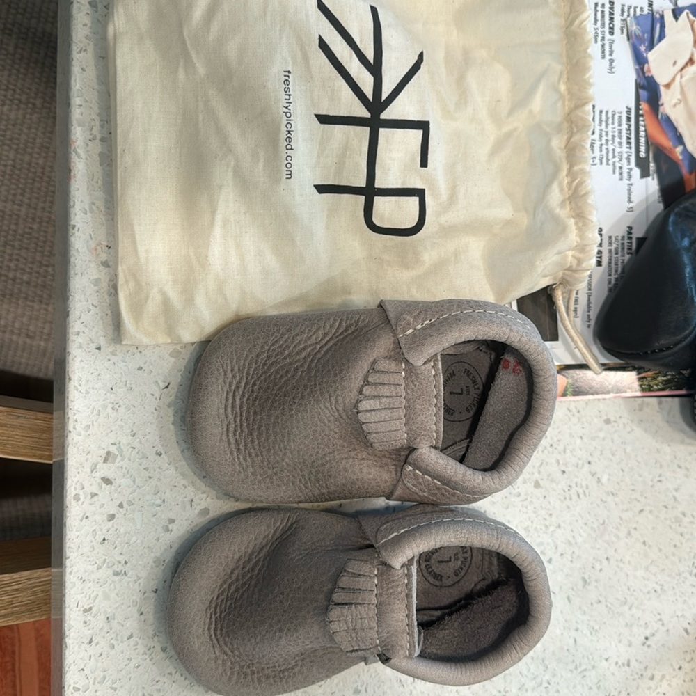 Brand new never worn. Freshly picked baby mosccasins. Size 7